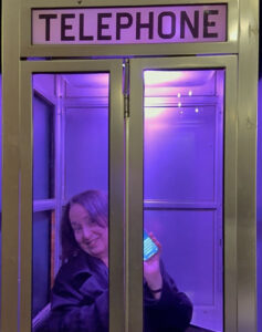 An iPhone in a Phone booth brings the contrast of what was and what is to life